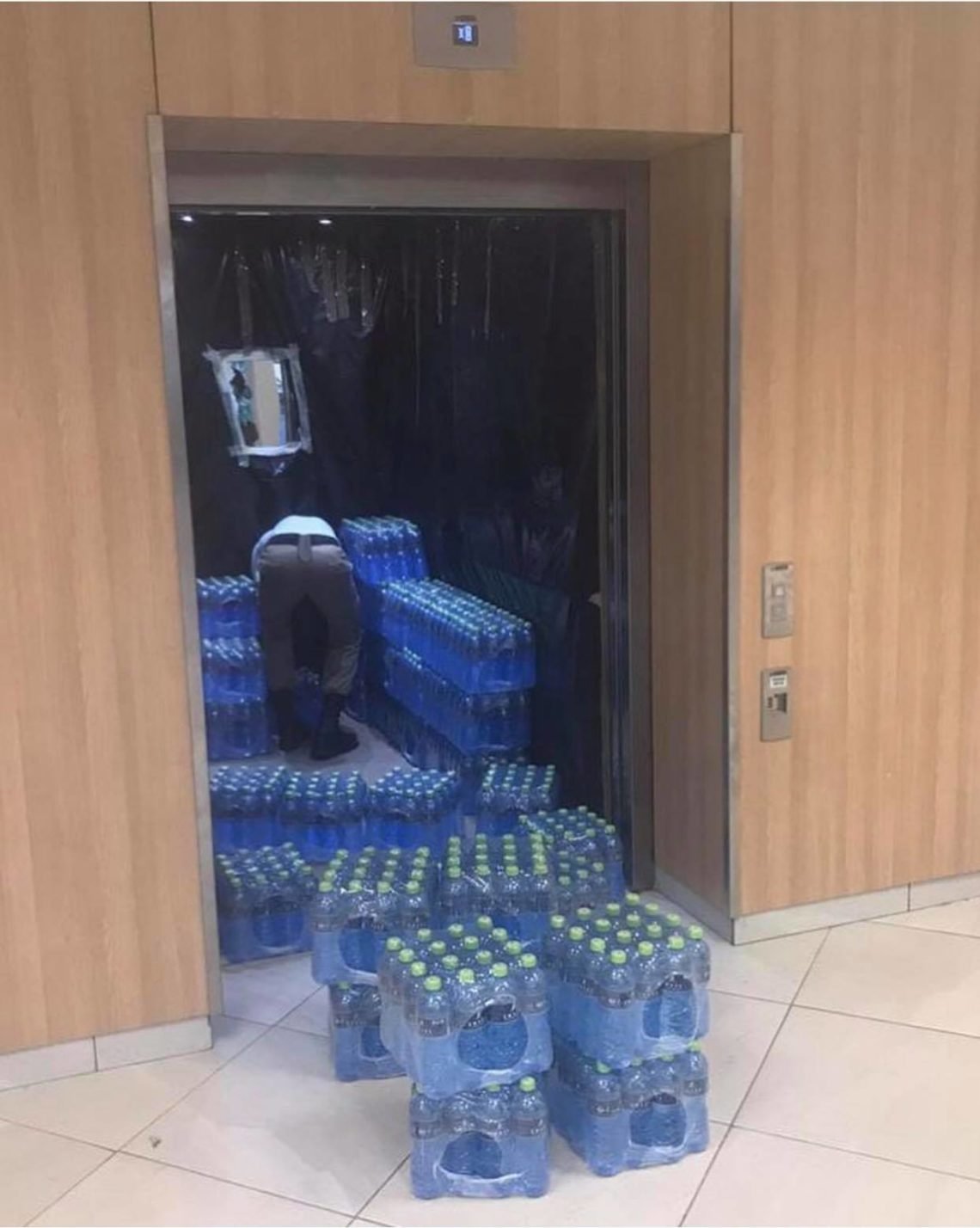 John Dumelo donates 100 packs of water to frontline health workers at the University of Ghana Medical center in the Ayawaso West constituency
