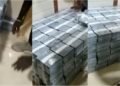 Video of house filled with bundles of cash with young men arranging monies emerges