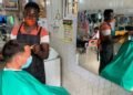 Australian Ambassador To Ghana, Gregory Andrews, gets a haircut from a local barber salon